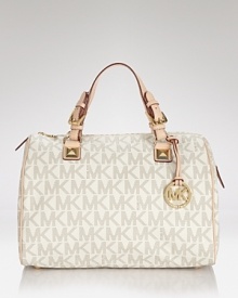 Put a signature spin on your look with this embossed PVC satchel from MICHAEL Michael Kors. Stamped with the label's iconic monogram, this perennially chic piece is a must for any logo-loving fashionista. Put a signature spin on your look with this embossed PVC satchel from MICHAEL Michael Kors. Stamped with the label's iconic monogram, this perennially chic piece is a must for any logo-loving fashionista.