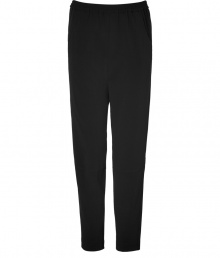 Both sporty and sophisticated, Theyskens Theorys black pants are chic staple perfect for both dressing up and down - Elasticized waistband, side slit pockets, back flap pockets, seam detailing under the knees - Loosely fitted - Wear with a boyfriend blazer, a tee and ankle boots