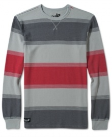 Always great as an underlayer or worn solo is this fashionable stripe thermal by Volcom.