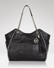 For the woman who refuses to sacrifice fashion in the name of function, this MICHAEL Michael Kors tote works on both fronts, crafted of rich leather. For the woman who refuses to sacrifice fashion in the name of function, this MICHAEL Michael Kors tote works on both fronts, crafted of rich leather.