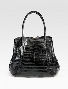 Stunning crocodile skin, superior tailoring and unique shape make for a finished, luxurious look.Double top handles, 7 dropMagnetic and zip closureOne outside zip pocketTwo inner compartmentsOne center zip compartmentOne inside zipper pocketThree inside open pocketsSuede lining>12W X 10H X 5DImported Stunning crocodile skin, superior tailoring and unique shape make for a finished, luxurious look.Double top handles, 7 dropMagnetic and zip closureOne outside zip pocketTwo inner compartmentsOne center zip compartmentOne inside zipper pocketThree inside open pocketsSuede lining>12W X 10H X 5DImported