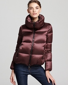 In an ultra soft, satin nylon, this plush and pillowy Moncler coat is a luxe investment for winter.