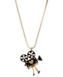 Project yourself with this necklace from Betsey Johnson. Crafted from gold-tone mixed metal and glass accents, this pendant will make sure you're ready for your closeup. Approximate length: 32 inches + 3-inch extender. Approximate drop: 2-1/4 inches.