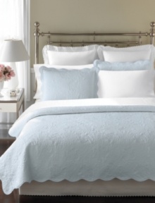 The Stenciled Leaves quilt from Martha Stewart Collection features bushels of leaves embossed over a light blue ground. Scalloped edges add a sense of elegance to this design in affordable cotton voile.