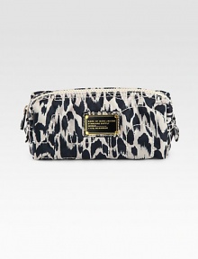 Carry essential beauty items in this sleek bag with signature letter stitching and a vivid graphic print. Top zip closureFully lined7½W X 3H X 2½DImported Carry essential beauty items in this sleek bag with signature letter stitching and a vivid graphic print. Top zip closureFully lined7½W X 3H X 2½DImported