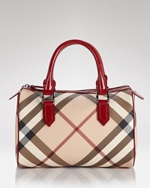 Burberry's iconic check lends luxe style to this classic bowling bag silhouette. Burberry's iconic check lends luxe style to this classic bowling bag silhouette.