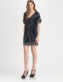 Constructed with luminous beads that form a tribal pattern, this silk v-neck dress has dropped shoulders, short dolman sleeves and a short silhouette. V-neckDropped shouldersShort dolman sleevesAbout 18 from natural waistBeaded silkDry cleanImportedModel shown is 5'10 (177cm) wearing US size Small.