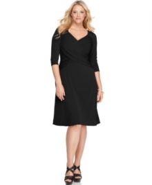 Look sensational and slender with Elementz' three-quarter sleeve plus size dress, featuring a slimming panel inset and an A-line shape.