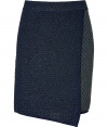 With the illusion of a wrap skirt, this flap front version offers the slim silhouette of a pencil with the comfort and versatility of a knit - Contrasting blue front flap, wide elasticized waist, two-tone metallic print, solid navy trim - Wear with a striped sweater or classic tee for easy elegance