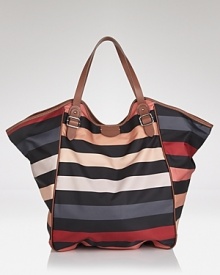 SONIA RYKIEL puts a playful (and practical) spin on Parisian chic with this tote. Crafted of durable nylon and sized-right for day, it packs a notable style punch in a Left Bank way. SONIA RYKIEL puts a playful (and practical) spin on Parisian chic with this tote. Crafted of durable nylon and sized-right for day, it packs a notable style punch in a Left Bank way.
