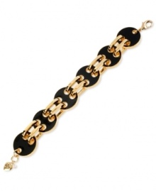 Beautiful in black. Betsey Johnson's link bracelet is crafted from gold-tone mixed metal with black glass circles making a subtle, yet refined, statement. Approximate length: 8 inches.