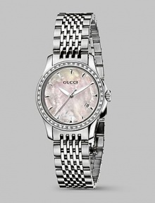 From the G-Timeless Collection. A prestigious design with classic, round face and diamond-patterned dial is encrusted with 42 luminescent diamonds and in the durability and lasting elegance of stainless steel. From the G-Timeless Collection. A prestigious design with classic, round face and diamond-patterned dial is encrusted with 42 luminescent diamonds and in the durability and lasting elegance of stainless steel.