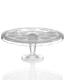 Past meets present. Feminine scalloped edges, raised medallions and fluted accents in sparkling glass make this Modern Vintage cake stand a standout at the table and on display. From the Godinger serveware collection. Past meets present. Feminine scalloped edges, raised medallions and fluted accents in sparkling glass make this Modern Vintage cake stand a standout at the table and on display. From the Godinger serveware collection.