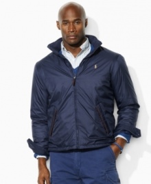 A classic-fitting lightweight windbreaker in high-performance water-resistant microfiber is equipped with a concealed zip-in hood for versatile protection. A classic-fitting lightweight windbreaker in high-performance water-resistant microfiber is equipped with a concealed zip-in hood for versatile protection.