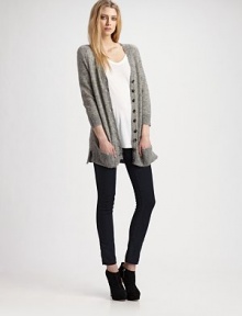 Long, light and luscious in a furry mohair blend.V-neckline Button front Low patch pockets Saddle shoulders Long sleeves Rib knit trim About 31 63% mohair/25% nylon/12% wool Dry clean Imported Long, light and luscious in a furry mohair blend.V-neckline Button front Low patch pockets Saddle shoulders Long sleeves Rib knit trim About 31 63% mohair/25% nylon/12% wool Dry clean Imported