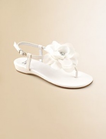 A graceful satin T strap blooms with a floppy flower of chiffon and tulle with a rhinestone center.Terylene satin upperT strap thong with flowerBuckle ankle strapFaux leather sole with rubber insertPadded insoleFaux leather liningImported A graceful satin T strap blooms with a floppy flower of chiffon and tulle with a rhinestone center.Terylene satin upperT strap thong with flowerBuckle ankle strapFaux leather sole with rubber insertPadded insoleFaux leather liningImported
