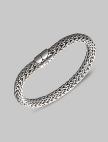 From the Kali Collection. An intricately woven strand of sterling silver with a textured barrel clasp. Sterling silver Length, about 7½ Push-lock clasp Made in Bali. From the Kali Collection. An intricately woven strand of sterling silver with a textured barrel clasp. Sterling silver Length, about 7½ Push-lock clasp Made in Bali.