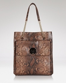 Crafted of embossed leather and dressed up with distinctive details, this kate spade new york carryall can go downtown, uptown and everywhere in between. Crafted of embossed leather and dressed up with distinctive details, this kate spade new york carryall can go downtown, uptown and everywhere in between.