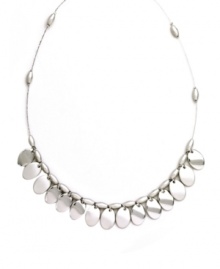 Shake up your look in polished style. Nine West's shimmery shaky necklace highlights reflective silver tone mixed metal discs strung from a delicate beaded chain. Approximate length: 16 inches. Shake up your look in polished style. Nine West's shimmery shaky necklace highlights reflective silver tone mixed metal discs strung from a delicate beaded chain. Approximate length: 16 inches.