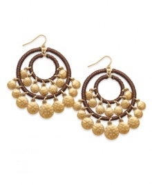Bohemian beauty. Recalling the free-spirited style of the 1960s, Lauren by Ralph Lauren's gypsy hoop earrings are embellished with hammered disks and cording. Crafted in gold tone mixed metal. Approximate drop: 1-1/2 inches. Bohemian beauty. Recalling the free-spirited style of the 1960s, Lauren by Ralph Lauren's gypsy hoop earrings are embellished with hammered disks and cording. Crafted in gold tone mixed metal. Approximate drop: 1-1/2 inches.