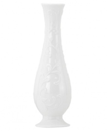 Featuring the embossed vine motif and shiny white glaze of the Opal Innocence Carved collection, this shapely bud vase is designed to refine your home indefinitely. A lovely bridal shower gift!