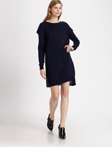 Merino wool sweaterdress in a relaxed silhouette with a boatneck and unique overlays at the shoulders. BoatneckOverlay at back of shouldersLong sleeves and banded cuffsAbout 18 from natural waistMerino woolDry cleanImportedModel shown is 5'10 (177cm) wearing US size Small.