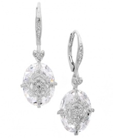 Breathtaking by design. Eliot Danori's intricate drop earrings features a faceted crystal drop decorated by a cubic zirconia-accented overlay (14 ct. t.w.). Set in silver tone mixed metal. Approximate drop: 5/8 inch. Breathtaking by design. Eliot Danori's intricate drop earrings features a faceted crystal drop decorated by a cubic zirconia-accented overlay (14 ct. t.w.). Set in silver tone mixed metal. Approximate drop: 5/8 inch.