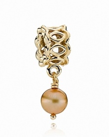 A delicate gold-tone freshwater pearl dangles from a lacy 14K gold PANDORA charm.