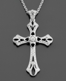 A traditional sterling silver cross pendant with ornate and delicate details featuring round-cut diamonds (1/5 ct. t.w.) for a pretty shimmer. Chain measures 18 inches; drop measures 2 inches. A traditional sterling silver cross pendant with ornate and delicate details featuring round-cut diamonds (1/5 ct. t.w.) for a pretty shimmer. Chain measures 18 inches; drop measures 2 inches.