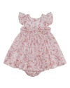 A charmingly traditional dress in crisp cotton features a dogwood floral pattern for a sweet summer look.