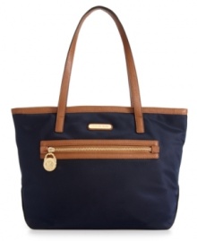The petite version of it's big sister, this go-anywhere Kempton tote from MICHAEL by Michael Kors is perfect for any outing. Signature 18k gold signature hardware dress up the casual nylon design, while the organized interior features plenty of pockets to safely stow all the essentials. The petite version of it's big sister, this go-anywhere Kempton tote from MICHAEL by Michael Kors is perfect for any outing. Signature 18k gold signature hardware dress up the casual nylon design, while the organized interior features plenty of pockets to safely stow all the essentials.