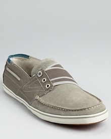 Tretorn's sporty take on the classic boat shoe adds a lower profile and a striped elastic band across the tongue. Tretorn's sporty take on the classic boat shoe adds a lower profile and a striped elastic band across the tongue.