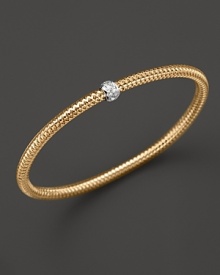 A single diamond station shines on this modern 18K gold mesh bangle from Roberto Coin. A single diamond station shines on this modern 18K gold mesh bangle from Roberto Coin.