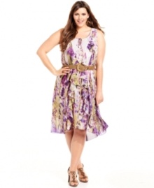 Nine West's plus size dress is the quintessential spring frock, outfitted with plenty of ruffles and a fresh, colorful print. Dress up or down with heels or your favorite wedges!