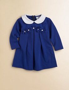 Matching flowers adorn the waist of this sweet, pleated frock with Peter Pan collar.Peter Pan collarLong sleevesBack zipperEmpire waistPleated skirtPolyester/Rayon/SpandexDry cleanImported Matching flowers adorn the waist of this sweet, pleated frock with Peter Pan collar.Peter Pan collarLong sleevesBack zipperEmpire waistPleated skirtPolyester/Rayon/SpandexDry cleanImported