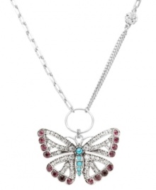 Free-spirited and fashionable, Fossil's whimsical butterfly pendant combines purple and clear crystals with reconstituted turquoise for color and shine. Crafted in silver tone mixed metal, pendant features a convertible chain and front toggle closure. Approximate length: 16 inches. Approximate drop: 2 inches.