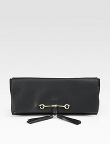 Leather flap design finished with iconic horsebit hardware and tassels. Flap with top zip closure14W X 6H X 2DMade in Italy Leather flap design finished with iconic horsebit hardware and tassels. Flap with top zip closure14W X 6H X 2DMade in Italy