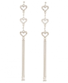 Follow your heart. A shimmering trio of crystal hearts sets apart these long, linear drop earrings from Betsey Johnson. Set in silver tone mixed metal with a chic multi chain silhouette, they'll add just the right amount of glitz and glamour to your going-out wardrobe. Approximate drop: 4-3/4 inches.