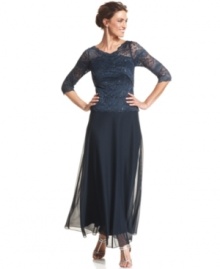 Patra's petite evening gown is adorned with a sequined lace bodice with sheer sleeves and a graceful, flowing skirt. Patra's petite evening gown is adorned with a sequined lace bodice with sheer sleeves and a graceful, flowing skirt.