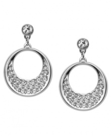 A modern interpretation of the circle motif. Swarovski's pair of rhodium-plated pierced earrings exude sophistication. Dangling circles are embellished in glittering clear crystal pavé. Set in rhodium-plated mixed metal. Approximate drop: 1 inch.