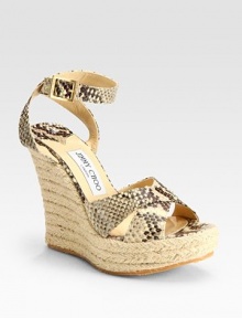 Snake-printed leather straps and an espadrille wedge says safari chic. Wedge heel, 5 (125mm) Platform, 1½ (40mm) Adjustable ankle strap Leather lining Rubber sole Made in ItalyOUR FIT MODEL RECOMMENDS ordering true whole size; ½ sizes should order the next whole size up.