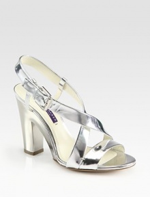 Beaming metallic leather criss-cross straps backed by a lacquered block heel and an adjustable slingback. Lacquered heel, 4 (100mm)Metallic leather upperLeather lining and solePadded insoleMade in ItalyOUR FIT MODEL RECOMMENDS ordering one half size up as this style runs small. 