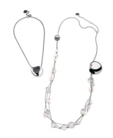 Two elegant looks combine into one chic style. Breil's versatile necklace can be worn as a single heart pendant, or as a long necklace accented by shimmering Mother of Pearl charms. Crafted in polished stainless steel. Approximate length: 14 inches + 4-inch extender. Approximate drop: 1-1/10 inches.