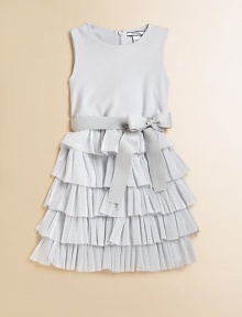 A party-perfect, sleeveless frock is frilly and fun with a ruffled metallic skirt and sash tie waistband.Round necklineSleevelessBack zipperWaistband with sash tieRuffled skirtBodice: CottonSkirt: 52% metallic polyester/48% nylonDry cleanImported A party-perfect, sleeveless frock is frilly and fun with a ruffled metallic skirt and sash tie waistband.Round necklineSleevelessBack zipperWaistband with sash tieRuffled skirtBodice: CottonSkirt: 52% metallic polyester/48% nylonDry cleanImported