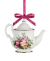 If you love it on your table, you'll adore it on the tree. This Old Country Roses ornament bears the classic pink and gold florals of Royal Albert's famed dinnerware collection in a mini teapot design.