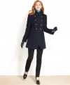 Military-inspired details update a classic double-breasted coat from DKNY. Tooled buttons add decorative appeal to a streamlined, structured silhouette.