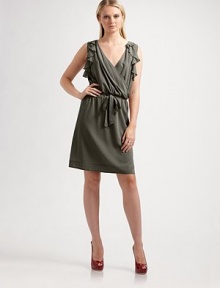 A whimsical silhouette with mock wrap-style bodice, cascading ruffles, and pleated waist.V-neck Sleeveless with cascading ruffles Wrap-style bodice Tie belt Pleated waist About 20 from natural waist 96% polyester/4% spandex Dry Clean ImportedOUR FIT MODEL RECOMMENDS ordering true size. 