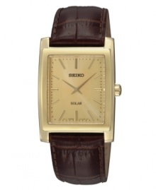 Casual cool and solar heat move this handsome Seiko watch. Crafted of croc-embossed brown leather strap and rectangular gold-tone stainless steel case. Champagne dial with applied stick indices at markers, hour and minute hands, and logo at twelve o'clock. Solar-powered quartz movement. Water resistant to 30 meters. Three-year limited warranty.