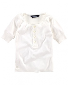 A classic Henley shirt is rendered in luxuriously soft cotton. A classic Henley shirt is rendered in luxuriously soft cotton.