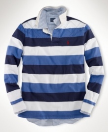 A long-sleeved striped rugby shirt is cut for a trim, modern fit from rustic utility cotton with a lightly filled diamond-quilted yoke for an athletic appeal. A long-sleeved striped rugby shirt is cut for a trim, modern fit from rustic utility cotton with a lightly filled diamond-quilted yoke for an athletic appeal.